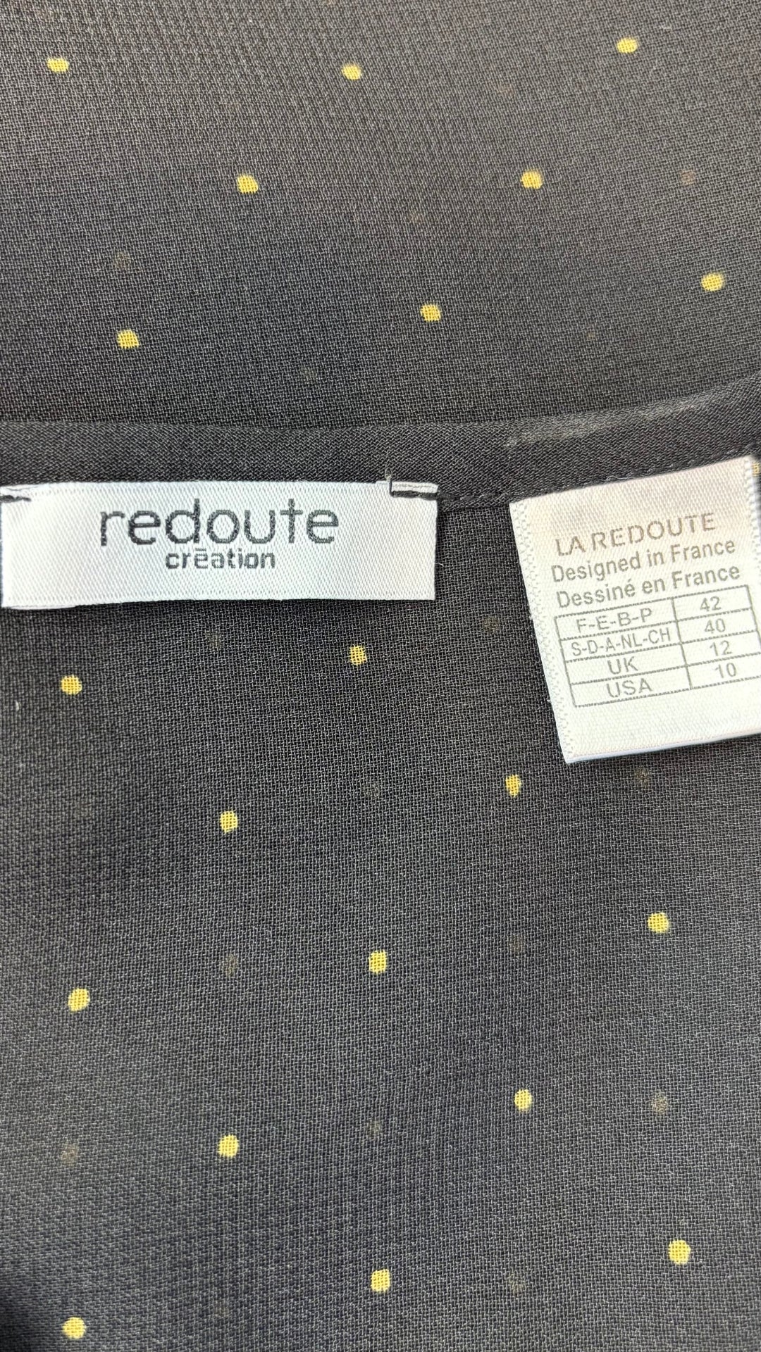 Blouse noire vaporeuse à pois dorés Redoute Création, taille 10 (medium). Vue de l'étiquette.