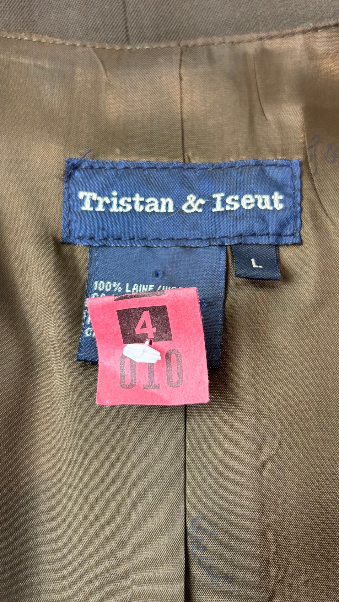 Gilet sans manches en laine vintage Tristan & Iseut, taille large (m). Vue de l'étiquette.