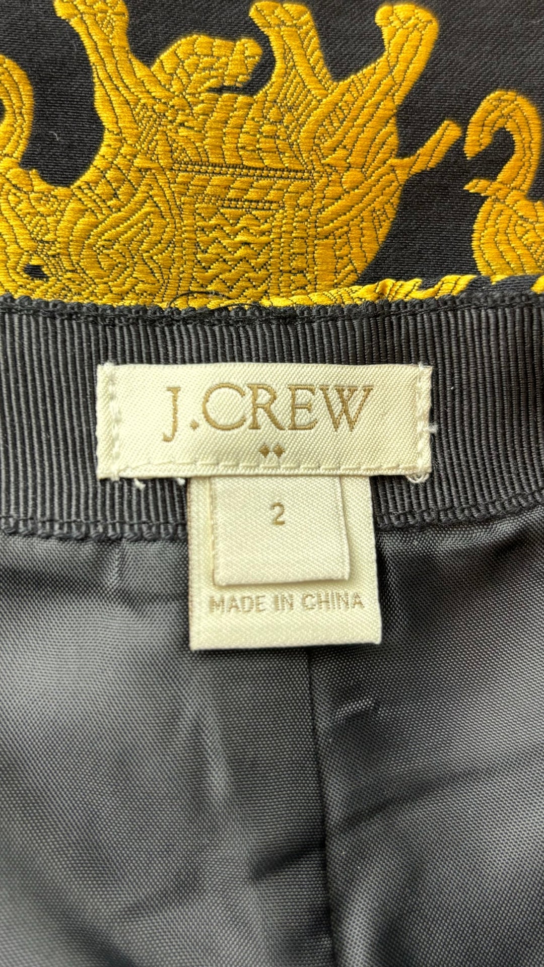 Jupe courte éléphants J. Crew, taille 2. Vue de l'étiquette de marque et taille.