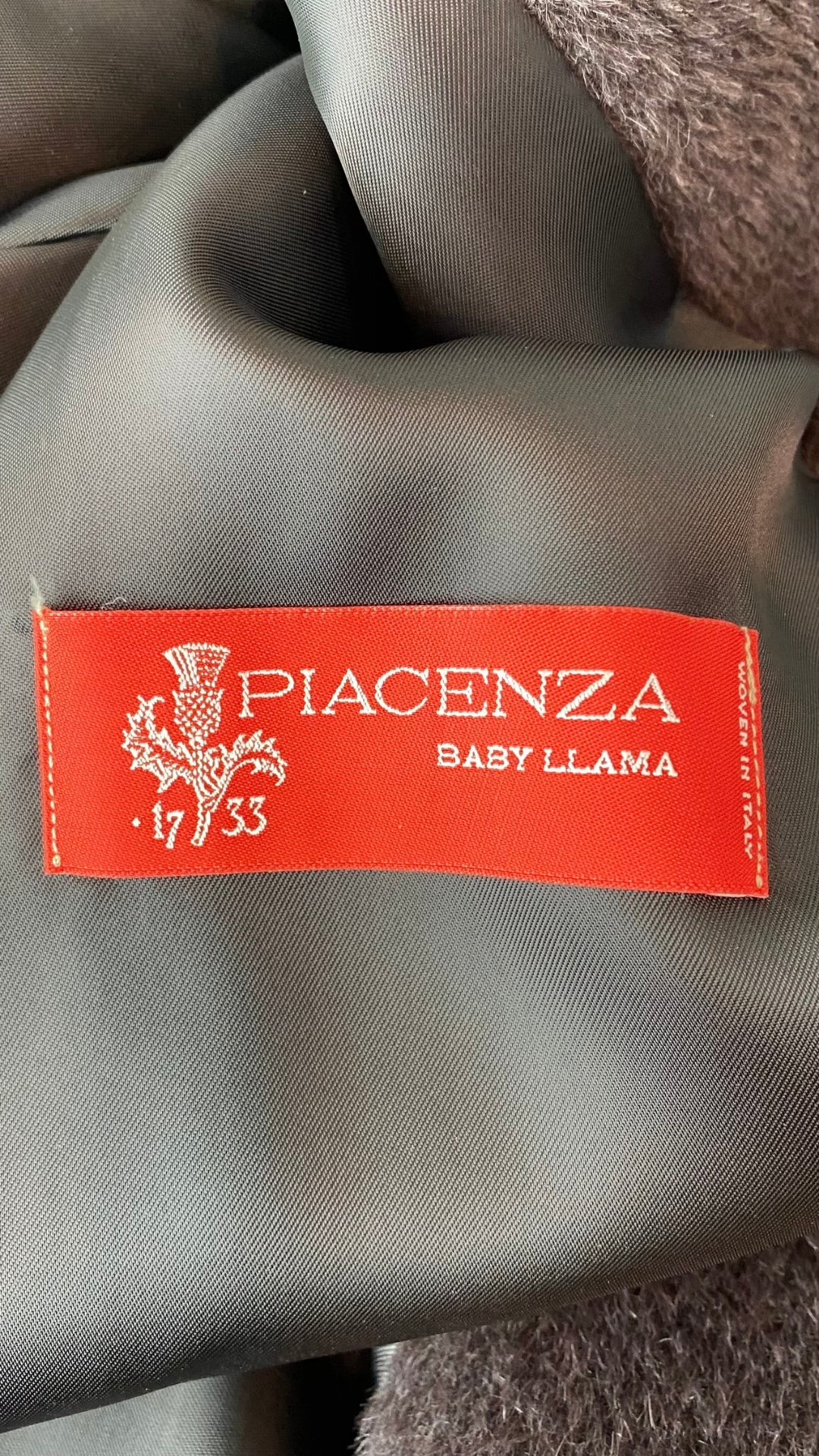 Manteau mi-long chocolat Cinzia Rocca, taille 12 (large et plus). Vue de l'étiquette de fibre.