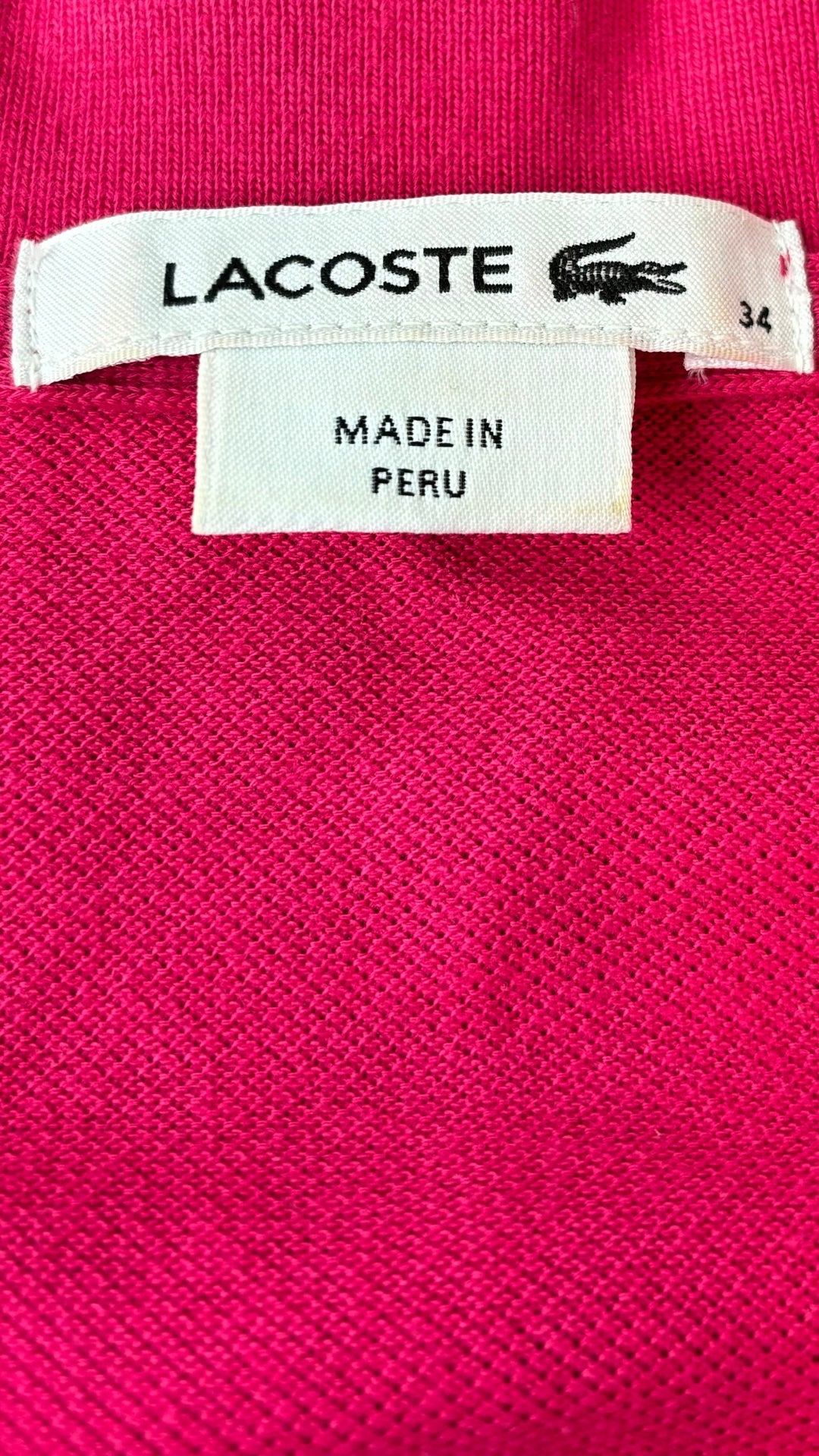 Robe polo piqué fuchsia Lacoste, taille 34 (xs). Vue de l'étiquette.